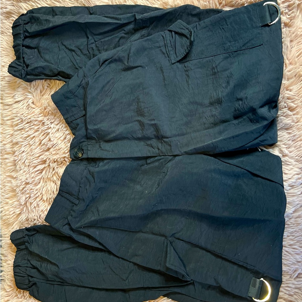 Black parachute pants.